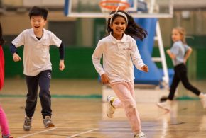 ICS-London-2024-girl-and-boy-running-in-sports-hall