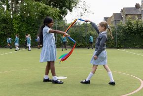 St-Andrews-2025-2-girls-playing-outside